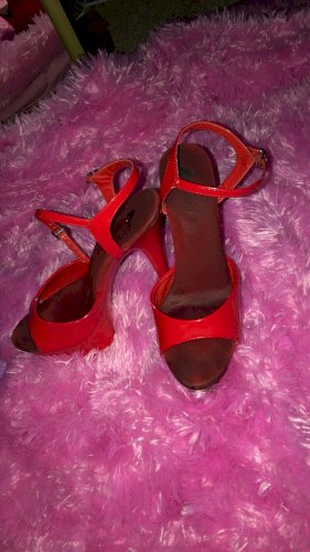 Red pleaser strip heels